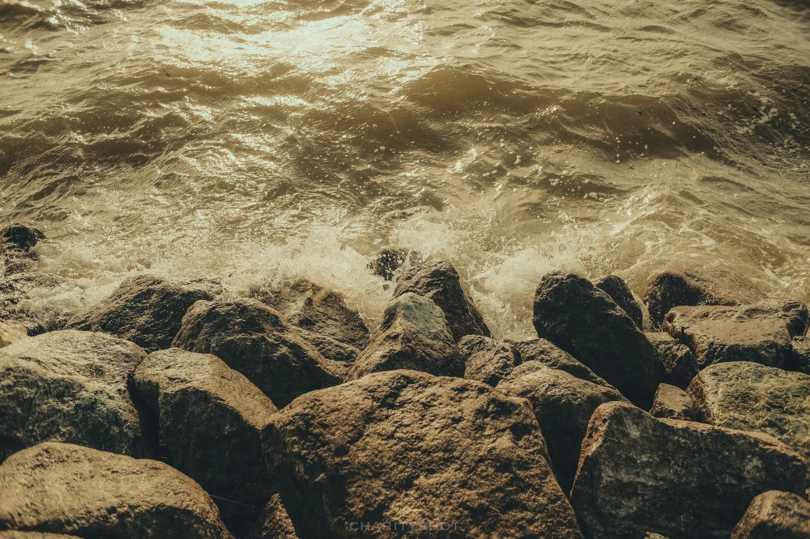 Waves crashing against Broadmarsh sea defences