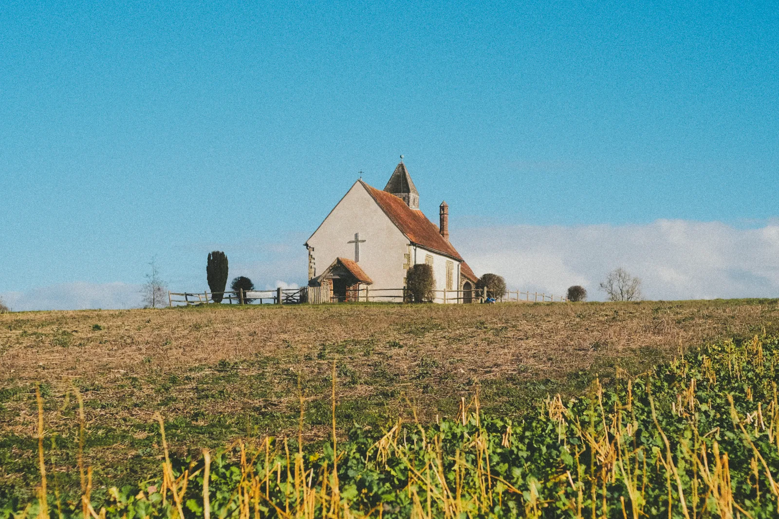 St Hubert's Church on the hillside surrounded by countryside