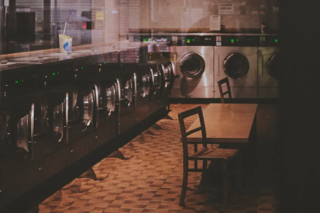 Empty laundromat at night in Southsea with liminal atmosphere