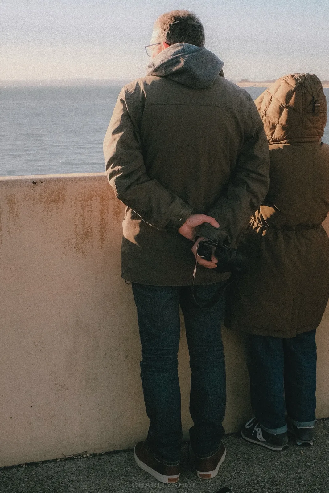 Spectator viewing HMS Prince of Wales from Portsmouth waterfront
